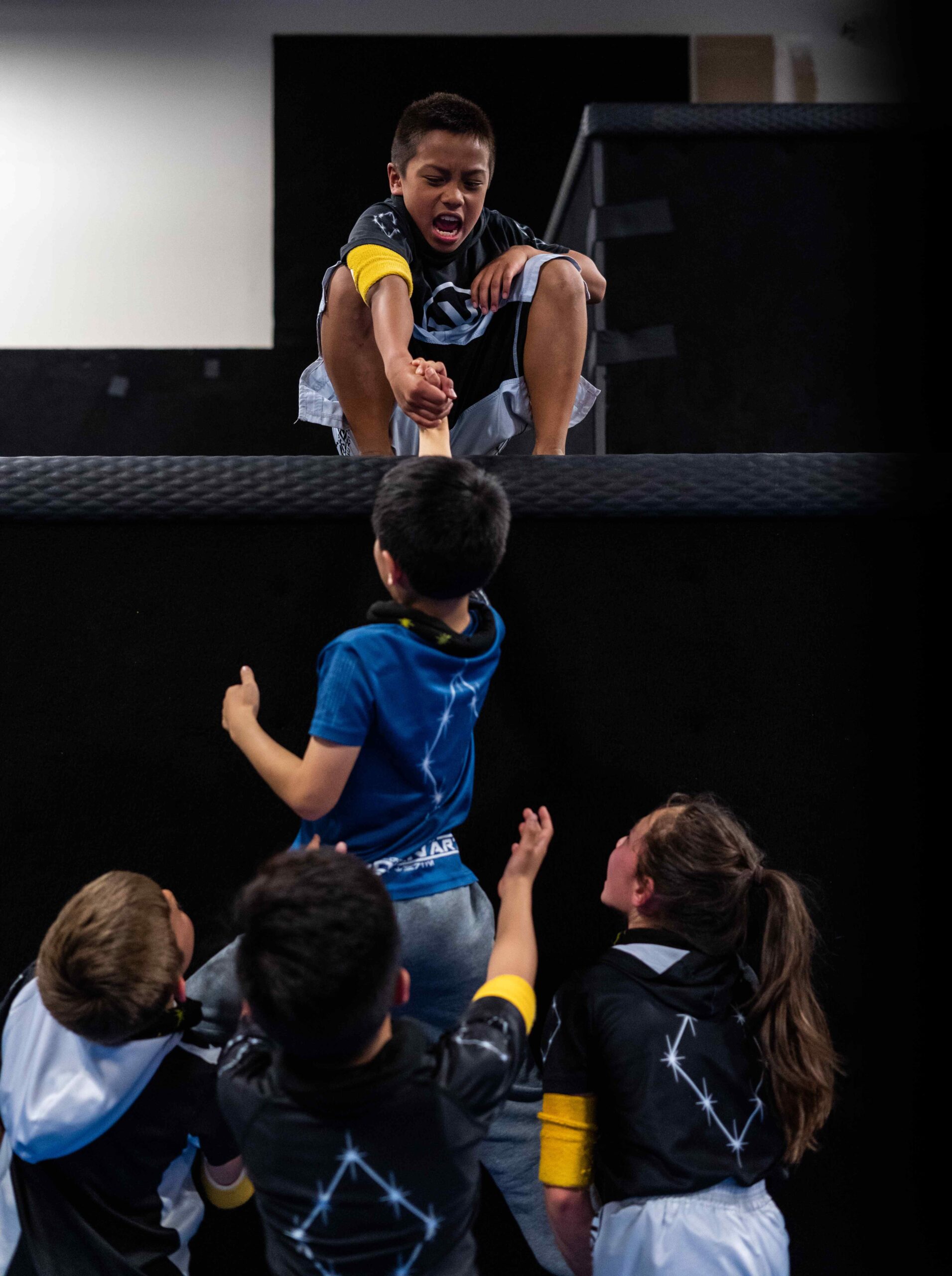Kids in class at a parkour gym in San Jose